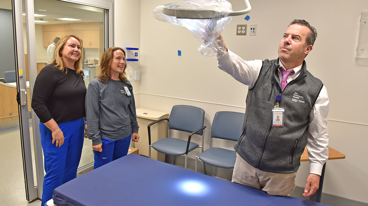 Craig Mittleman, MD inspected an exam light in one of the new private rooms 