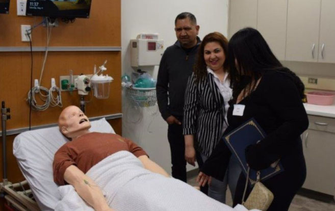 At the May 11 Simulation Academy at Yale graduation, students showed family members and friends the sim lab where they put classroom learning into practice.