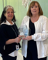 Patricia Poniros, RN, clinical navigator (right), and Louisa Correll, community health 